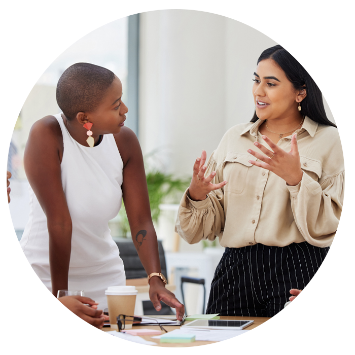 women talking in a meeting